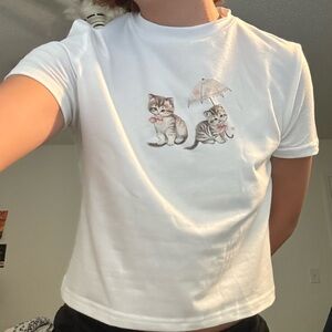 Two kittens with an umbrella white baby tee